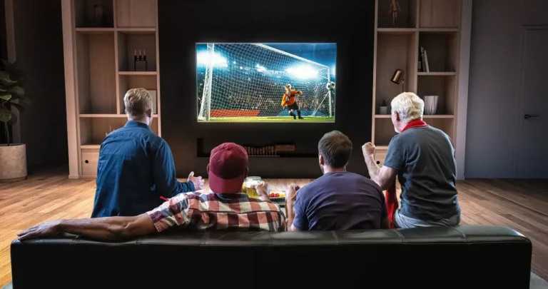 People watching live football on TV using IPTV UK service